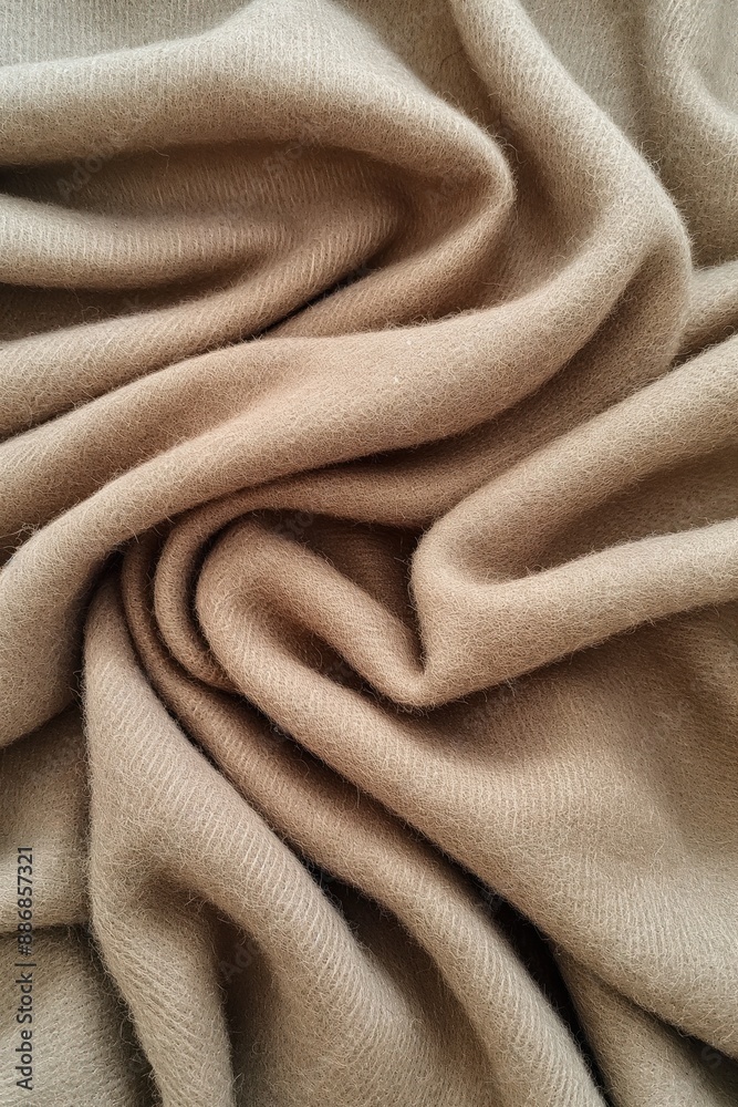 Poster soft beige cashmere fabric texture with smooth surface, slightly wrinkled. close-up view of natural 