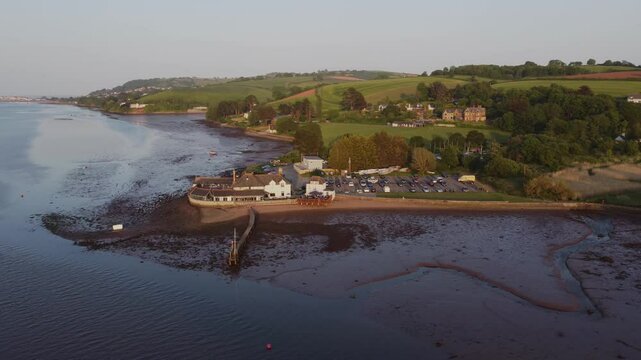 A drone view of the estuary of the River Teign, shot at Coombe Cellars, near Newton Abbot, with the seaside town of Teignmouth in the distance, Devon, England, United Kingdom, Europe