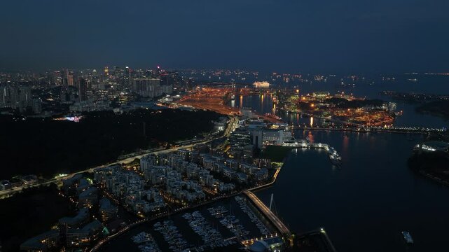 Singapore, Santosa island and city skyline. Aerial time lapse at night