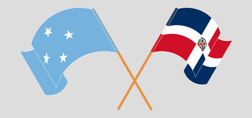 Crossed and waving flags of Micronesia and Dominican Republic
