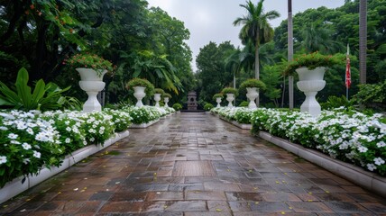 Fototapeta premium A walkway with white flowers and white vases
