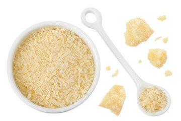 grated parmesan cheese in ceramic bowl and spoon isolated on white background. Top view. Flat lay