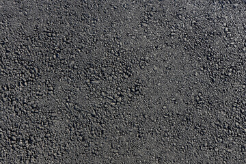 Fototapeta premium Freshly paved asphalt road texture close up
