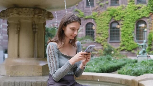 Young woman holding smartphone, surfing, using mobile apps for online shopping, e learning, social media, typing chat message on mobile phone, smiling girl use cell phone chatting, searching