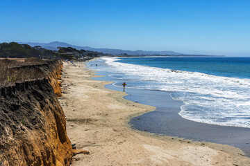 Surfers enjoying  the day time at the half moon bay surfers beach, Half Moon Bay, San Mateo, CA.