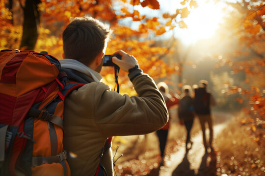 Group of friends hiking through autumn forest