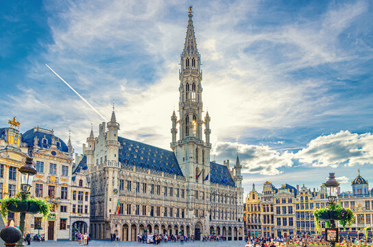 The Grand-Place Grote Markt Big Market square in Brussels city historical center with crowd people tourists, Town Hall Brabantine Gothic style and Baroque guildhalls Guilds of Brussels, Belgium