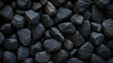 Black Rock Wall Texture, a textured wall made of dark, rough rocks. The natural pattern and dark tones create a dramatic and mysterious atmosphere, perfect for backgrounds, textures, or design element