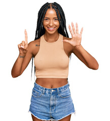 Beautiful hispanic woman wearing casual clothes showing and pointing up with fingers number six while smiling confident and happy.