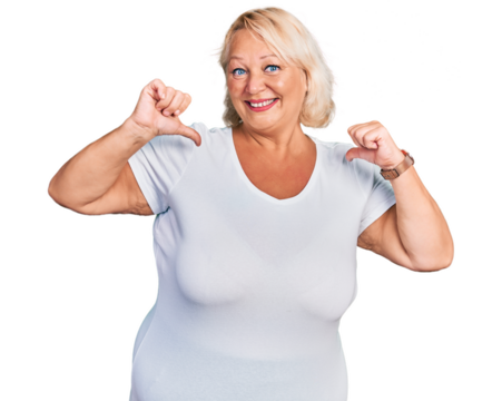 Middle age blonde woman wearing casual white t shirt looking confident with smile on face, pointing oneself with fingers proud and happy.