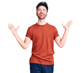 Young hispanic man wearing casual clothes celebrating victory with happy smile and winner expression with raised hands