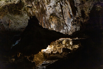 Postojna Cave, Slovenia. Famous tourist attraction, route that winds for several km. Departure by train to reach the route on foot. Stalagmites, stalactites and proteus lizard. family holidays,unique.