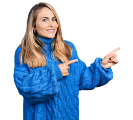 Young blonde woman wearing casual sweater pointing aside worried and nervous with both hands, concerned and surprised expression