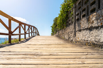 Fototapeta premium Wooden bridge to the beach at the Northern Litoral Natural Park in Galicia, Spain. High quality photo