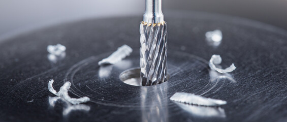 Milling cutter make sink in hole in steel billet. Locksmith work.