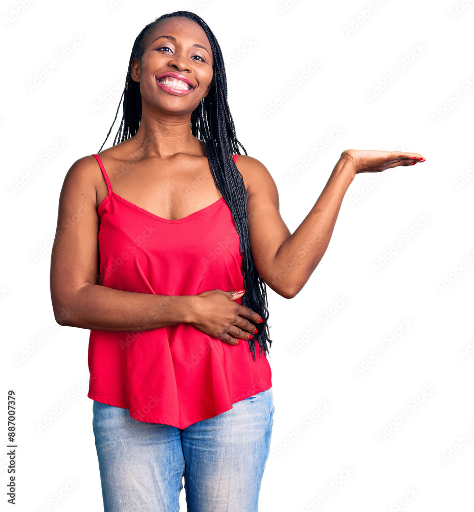 Poster young african american woman wearing casual clothes smiling cheerful presenting and pointing with pa