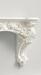 Fototapeta premium A close-up view of a white ornate shelf bracket with a floral design, set against a gray background