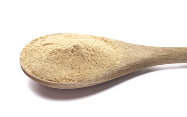 Black maca organic powder in wooden sppon isolated on white, side view