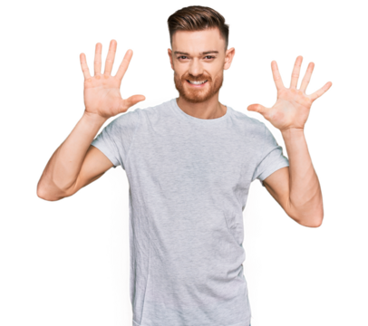 Young redhead man wearing casual grey t shirt showing and pointing up with fingers number ten while smiling confident and happy.