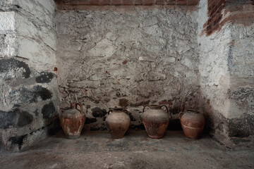 A few antique jugs on the street of a coastal town in Sardinia. Orosei, Sardinia, Italy