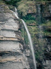 Majestic Waterfall Cascading Down Rocky Cliffs © Jorge
