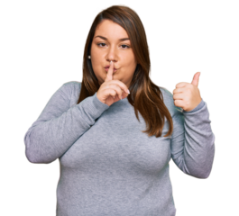 Beautiful brunette plus size woman wearing casual clothes asking to be quiet with finger on lips pointing with hand to the side. silence and secret concept.