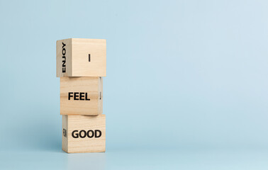 Wooden cubes with inscriptions I Feel Good on a blue background