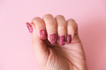 Home gel polish removal concept. Cracked varnish from gel remover