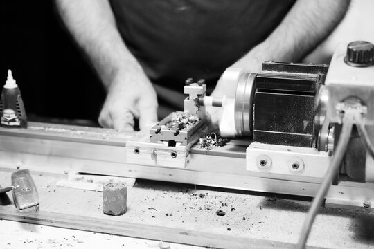 Craftsman repairing billiard cue tip.