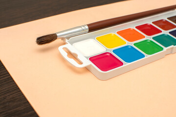 Paintbrush and palette of watercolor paints	