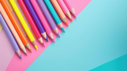 Fototapeta premium Vibrant color pencils on pastel backdrop with text space School theme flat lay mockup