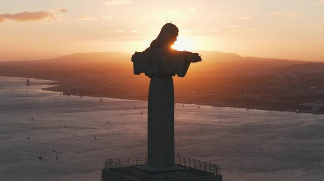 Aerial view of Sanctuary of Christ the King or Santuario de Cristo Rei on sunny summer day at sunset. Mighty catholic monument.