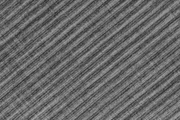 Ridge texture background of velour black cloth. Large ribbed, diagonal coarse weaving fabric