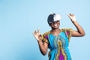 Modern confident woman using vr headset with artificial intelligence tech, enjoying innovative 3d virtual reality glasses. Optimistic charming adult using futuristic interactive AI gadget.