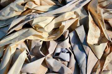 Old scraps of white tarpaulin as background