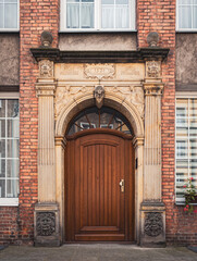 Carved wooden old door of the historic house