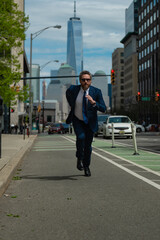 Business man run in NY. American business. Businessman run down street, late for a meeting. Businessman in suit run be success. Running business man. Fast business. Run and late businessman.