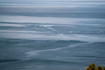 Aerial View of Ocean With White Streaks. Sea buoy. A wide shot of the ocean taken from a high...