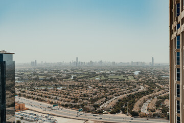 Panoramic cityscape view with high-rise buildings and suburban areas
