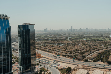 Obraz premium Urban city view with a highway and skyscrapers on the background of blue sky