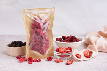 Composition with tasty freeze-dried berries on light background