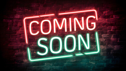 Fototapeta premium A neon sign against a brick wall backdrop. The sign is illuminated in vibrant shades of red and green, with the words 'COMING SOON' prominently displayed. The neon glow contrasts sharply with the dark