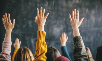 Hands raised in classroom, students asking questions.