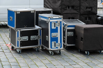 musical equipment for a show, wooden boxes with wheels for concert stage equipment before a concert.