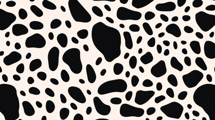 A pattern of black spots of various sizes and shapes on a white background