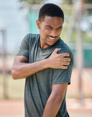 Fitness, man and shoulder pain by runner after exercise, training and morning run in city on...