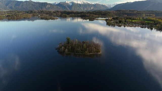Aerial view, Staffelsee with islands, Garmisch Partenkirchen region, Bavaria, Germany near Murnau in sunny weather at sunset in spring. Drone view over islands of a large beautiful lake in Bayern. 