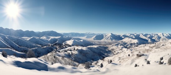 Obraz premium Snowy Mountain Range Panorama on a Sunny Day