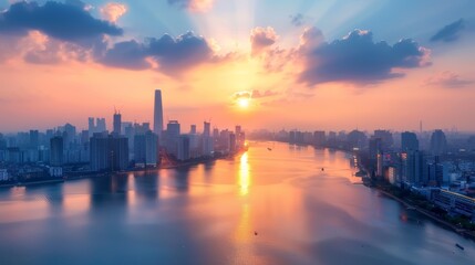Fototapeta premium City skyline at sunset with river reflections