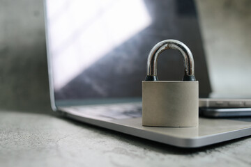 Digital Technology Device With Padlock Over Grey Background. Data And Privacy Security.